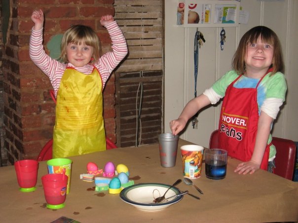 making easter eggs with my daughters in an unfinished kitchen