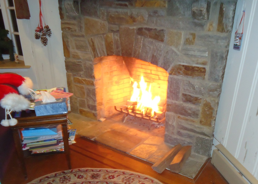 Lit Fire Stone Fireplace