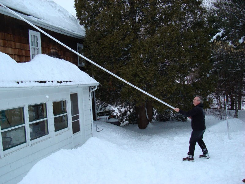 John Poole home made roof rake in action