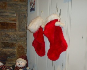 Christmas Stockings Hung on a Wall by a Fireplace